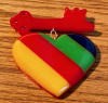 SZ55 Shultz red/laminated stripes bakelite heart/key pin